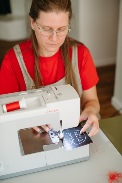 Michelle Ott sewing the postcard of the month from her Postcard Machine subscriptions
